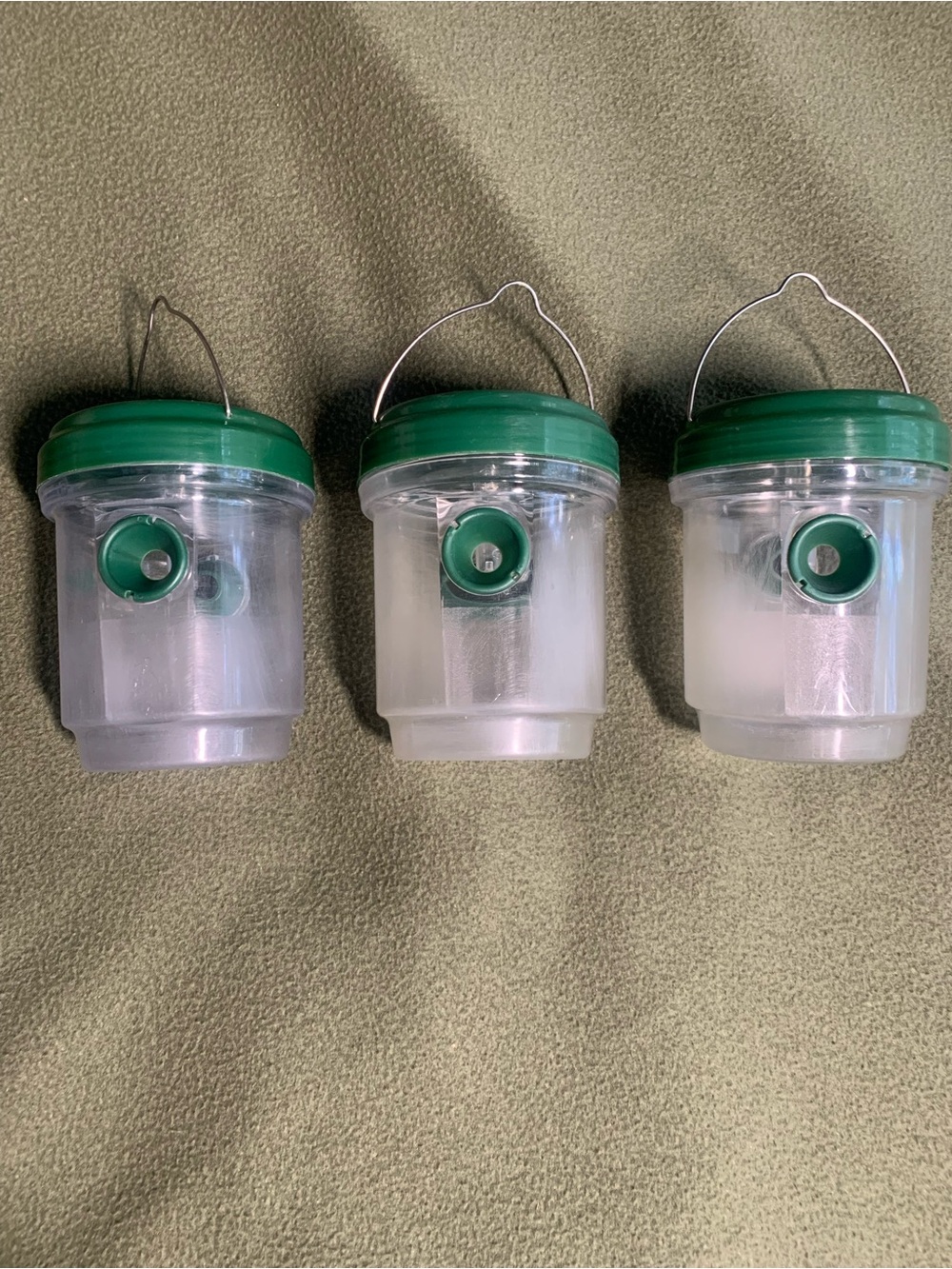 Used solar wasp traps w/ LED &hangers. Green and clear. Approx 3 3/4” x 4 1/2”